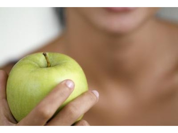 Woman holding apple