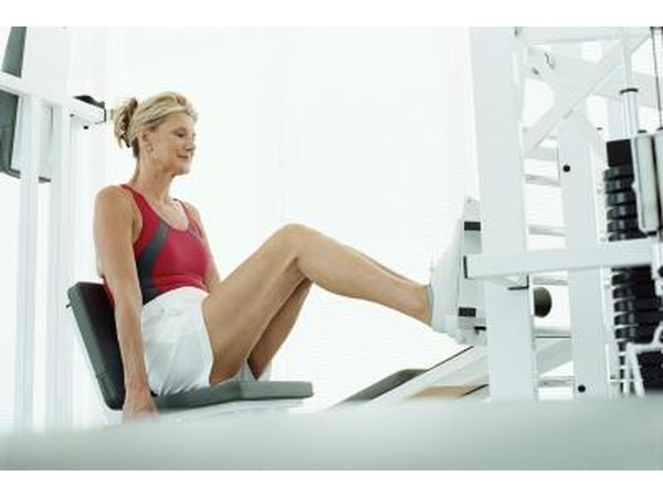 Aw Oman uses a leg press at a gym.
