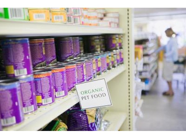 cans of dog food at store