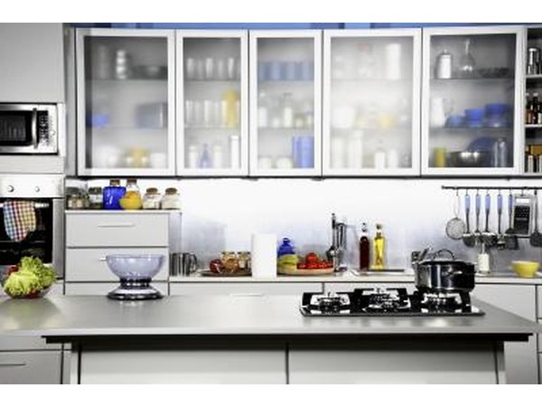 Recycled glass countertops have a neutral or light colored background flecked with varying sized pieces of color glass