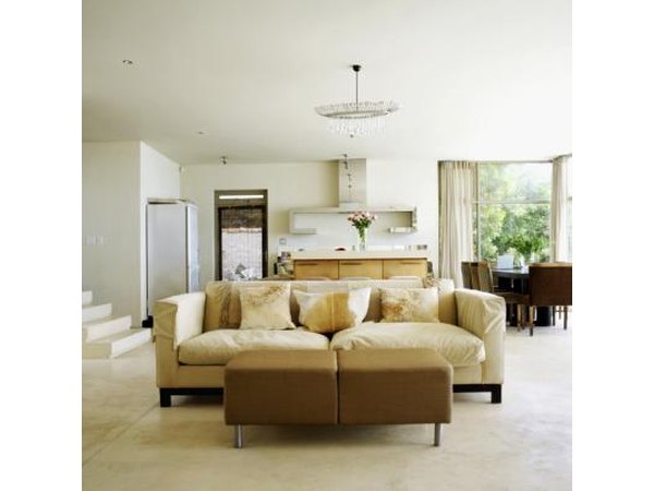A couch is placed in the center of a room.