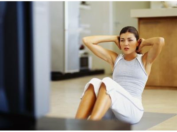 Woman working out to video