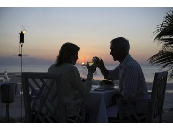 Couple toast at sunset at Little Torch Key resort terrace