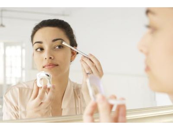 Woman applying eyeshadow