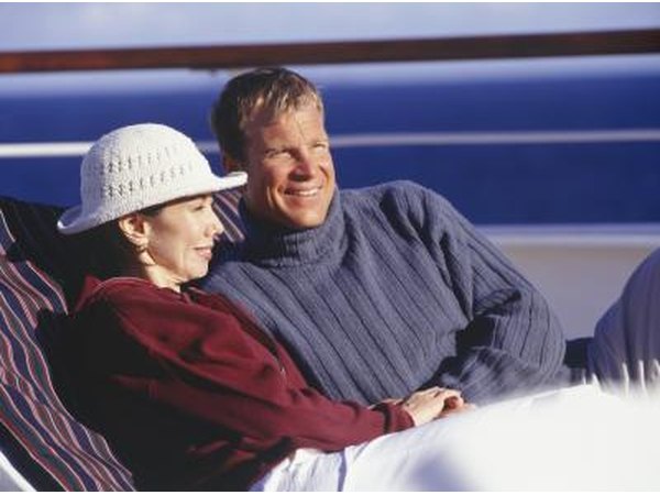 A couple enjoys the view in lounge chairs.