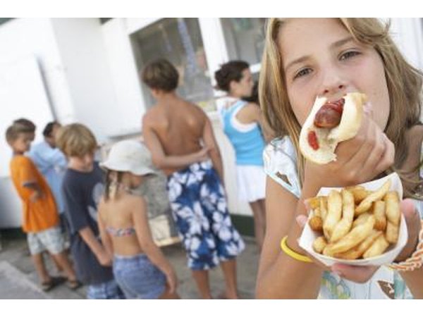 Hamburgers and hot dogs are a big hit with children at the Little League ball park.
