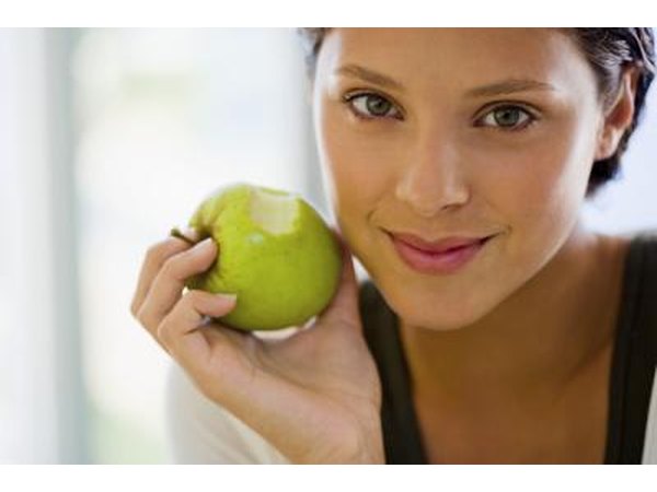 woman holding an apple