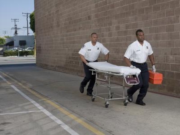 Pair of EMTs with gurney