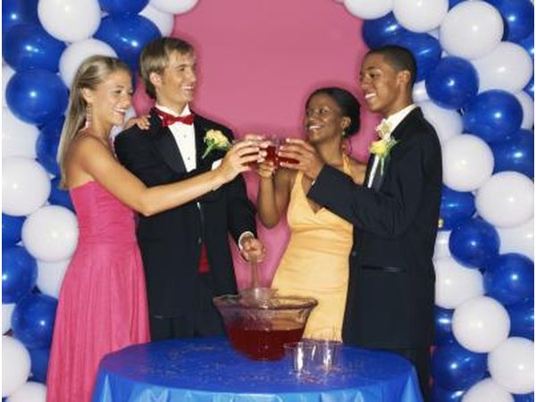 Friends toasting over punch bowl at prom