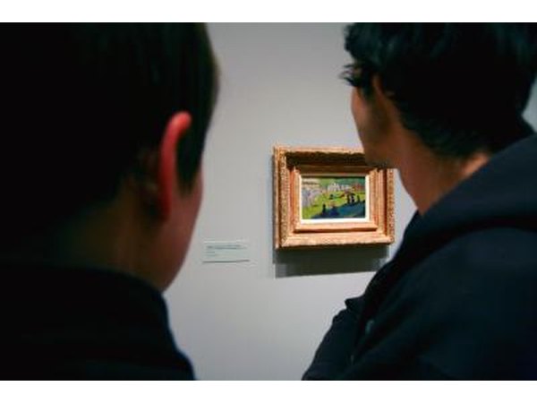 Men looking at Georges Seurat painting in muesum