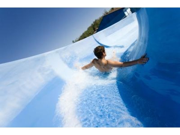 Man riding on water slide
