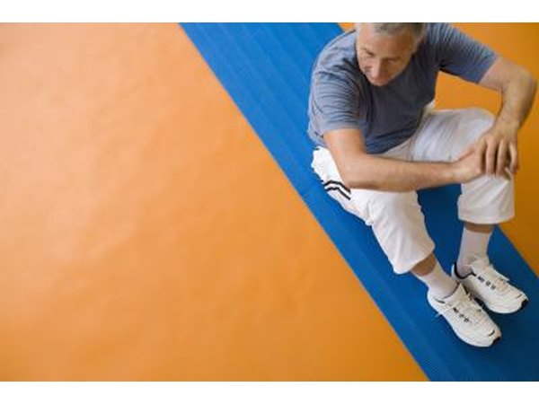 Perform a lower body workout consisting of squats, calf raises, leg extensions, and bicep curls.