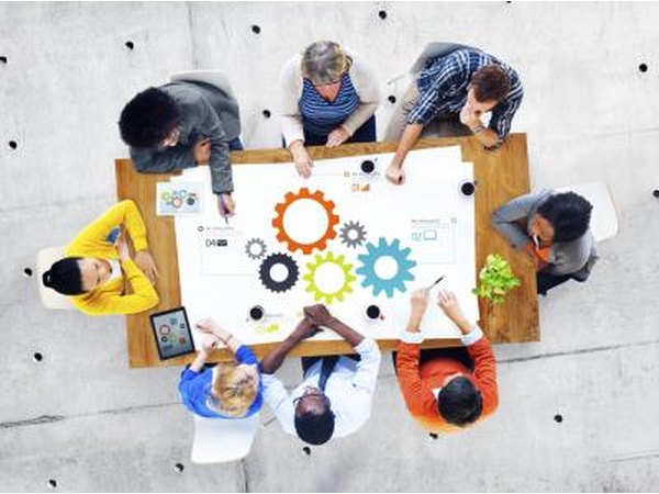 A group of college students sitting together conducting a meeting.