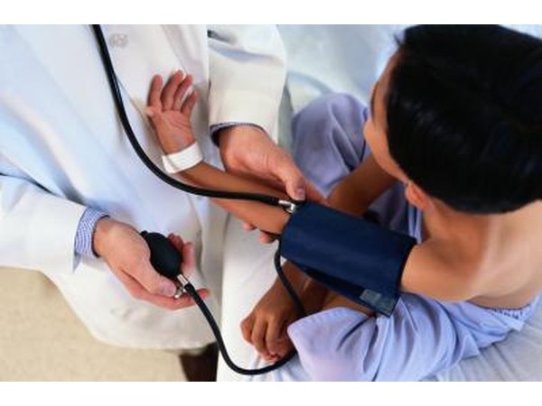 child having his blood pressure taken