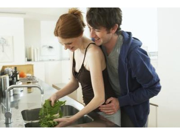 Couple preparing vegetables.