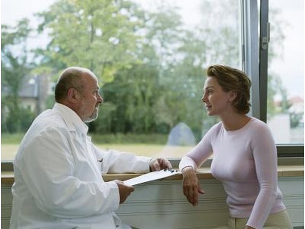 Woman talking with doctor