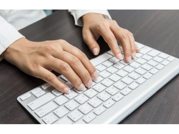 Woman typing on keyboard