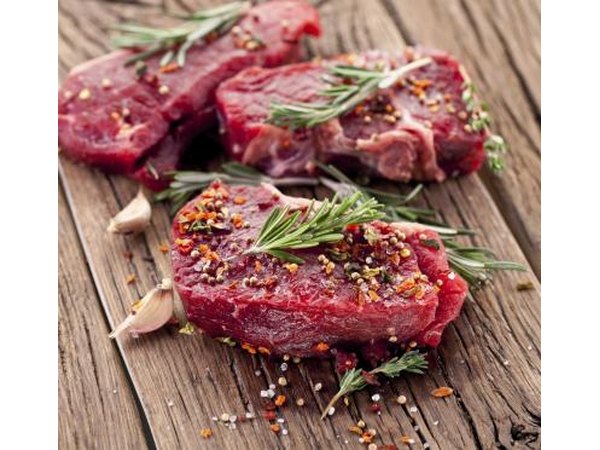 Raw filet mignon with herbs and spices