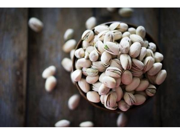 Small bowl of pistachio nuts.