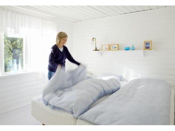 Woman looking at bedding