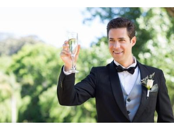 groom giving toast at wedding