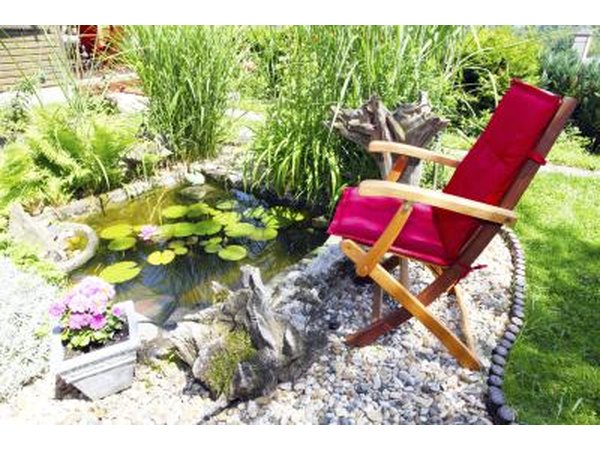 A patio with a small pond.
