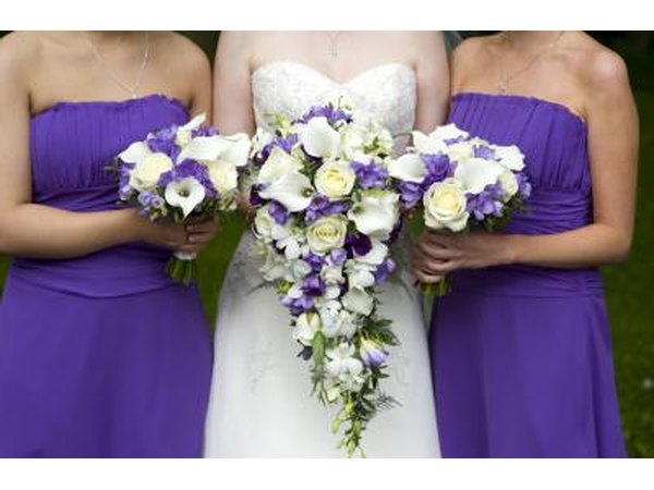 Bride and bridesmaids with flowers.