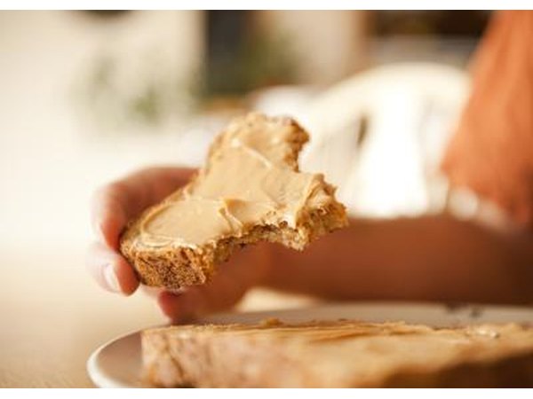 Close-up of peanut butter whole wheat toast being eaten.
