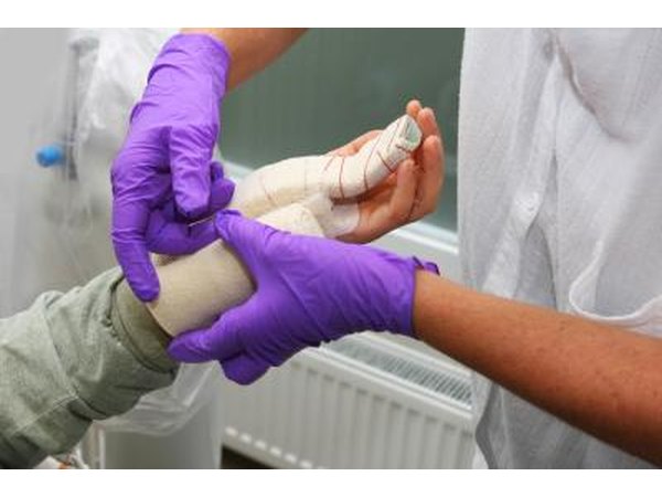 Woman wrapping wound