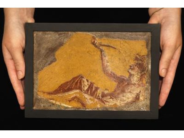 Colorful wall painting fragment found in the ruins of Pompeii