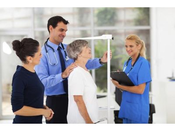Senior woman gets height measured