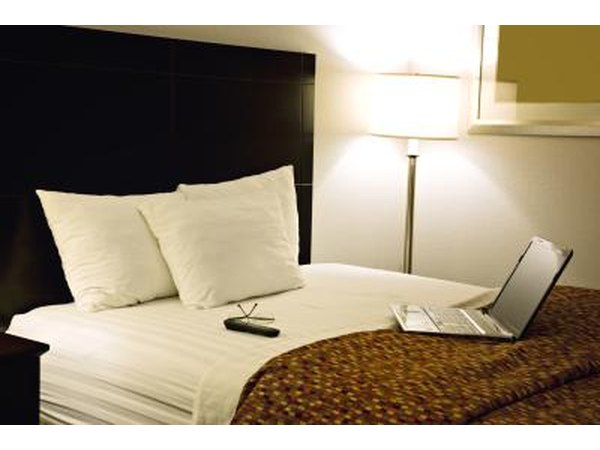 Computer on hotel bed