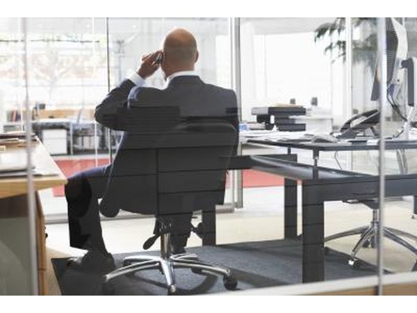 Man talking on phone in office