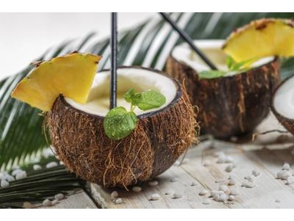 Close-up of two cocktails served in coconut shells