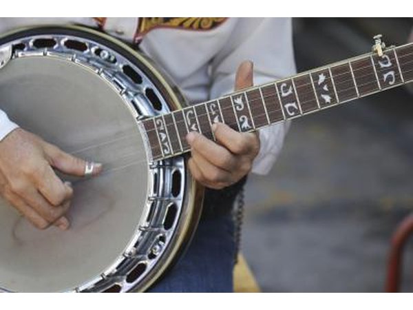 Close-up of somebody playing the banjo.