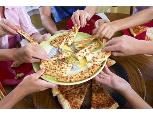 Group of friends sharing pizza