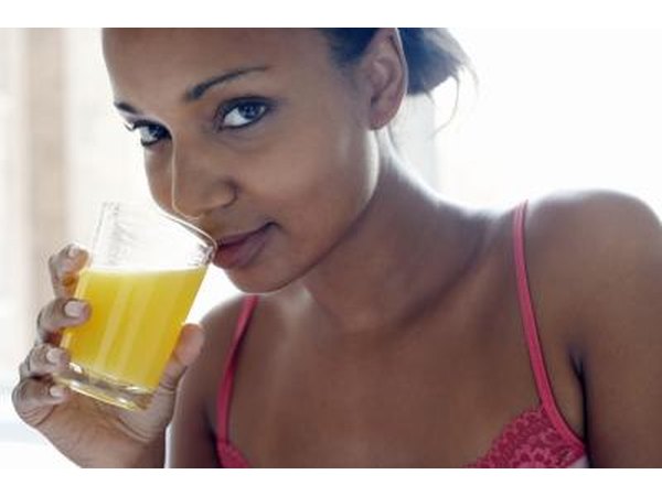 woman drinking pineapple juice