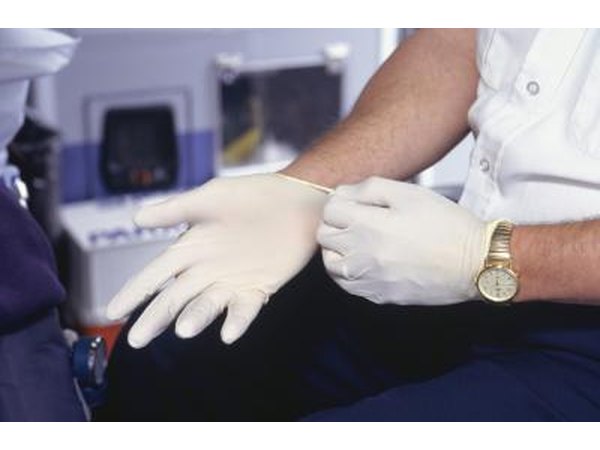 Put on nonsterile plastic gloves before touching or treating the wound.