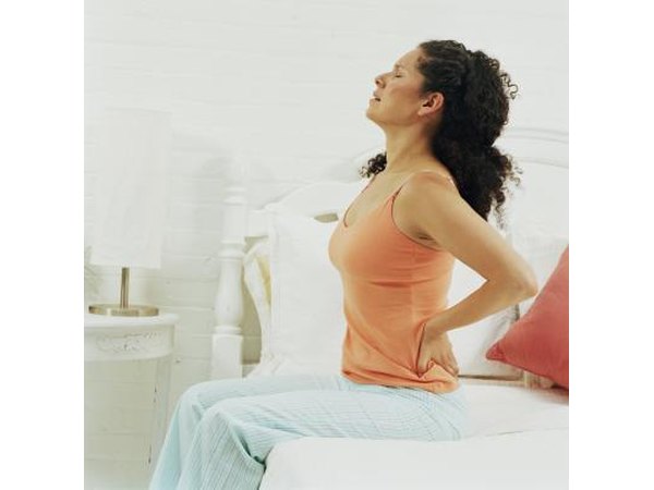 Proper posture is important to reduce back pain as a result of bow legs.