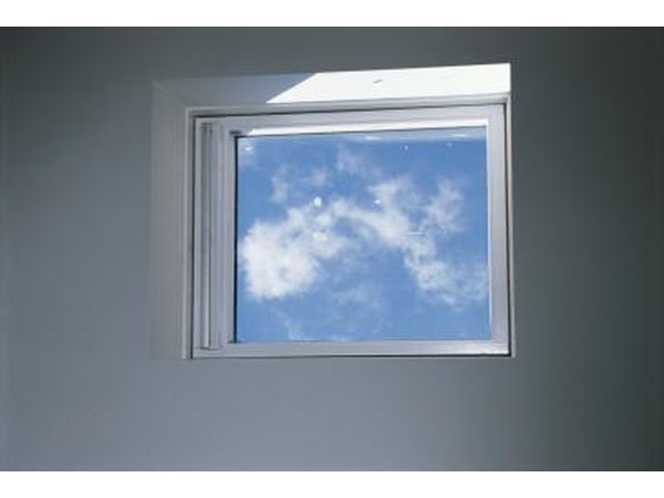 Wall painted gray with a window showing blue sky.
