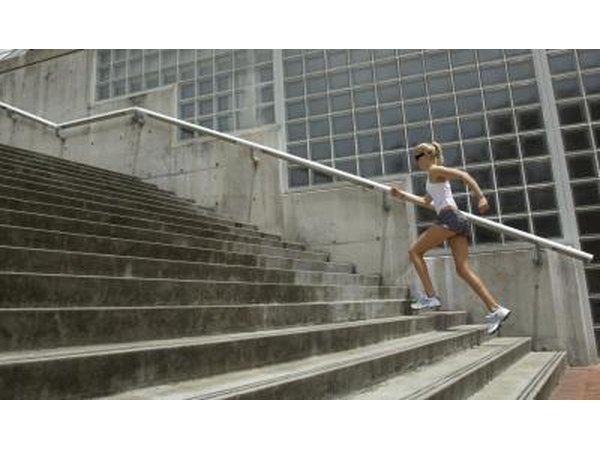 Woman jogging up stairs.