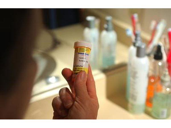 Person holding prescription bottle