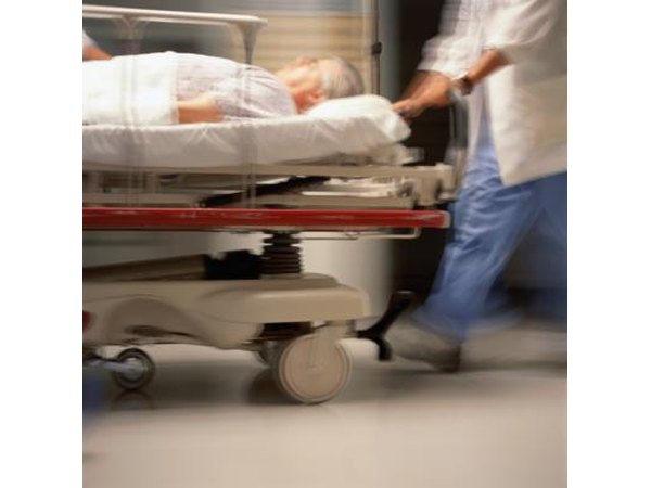 Older man being rushed through Emergency Room