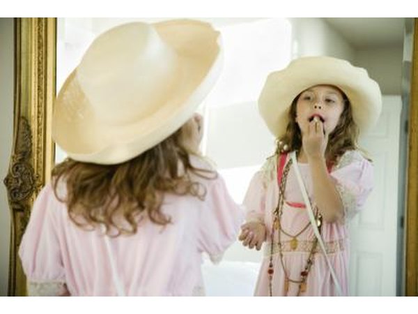 Little girl playing dress up