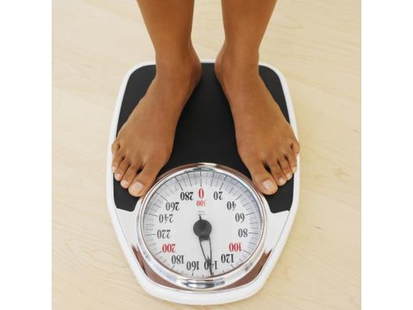 Woman weighing herself