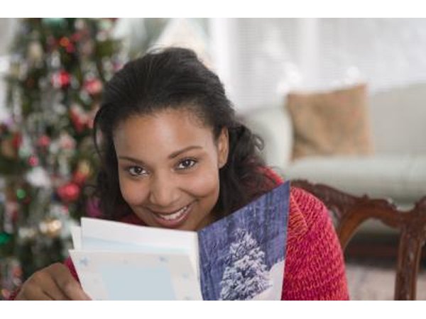 Share your holiday cards with your family, friends and guests by creating a ribbon card holder.