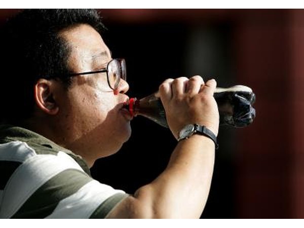 Man drinking cola soft drink