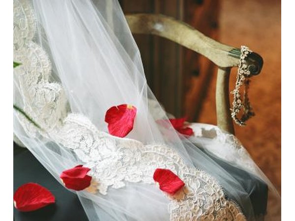 The veil covers the light which emanates from the bride on her wedding day.
