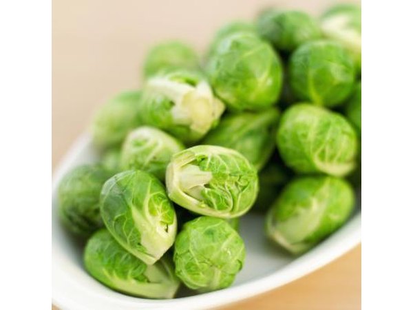 A plate of fresh brussels sprouts.
