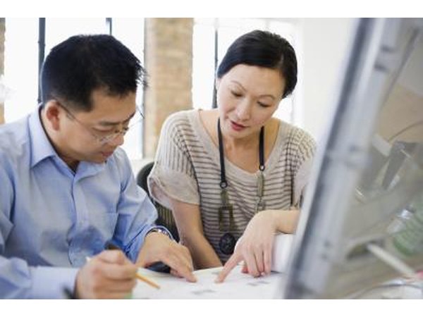 Business colleagues working in office